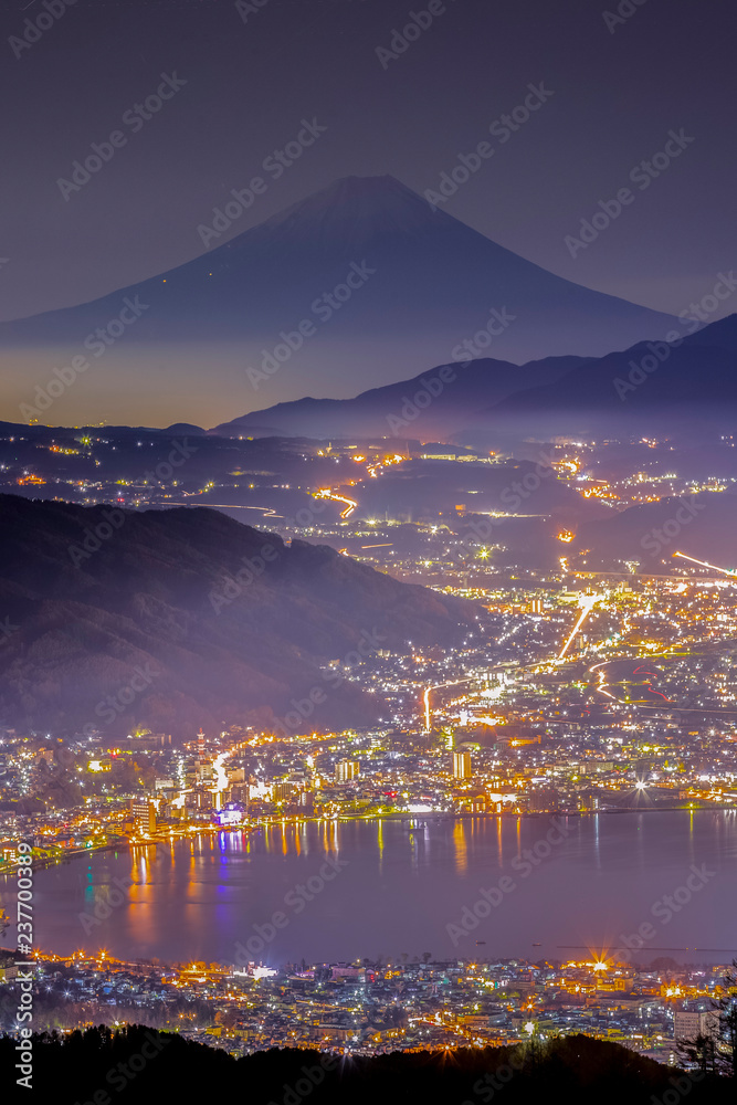 Aerial Mount Fuji with Suwako Lake at night seen from Mt. Takabochi