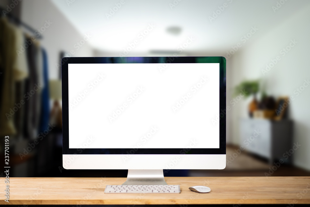 workspace with computer, laptop, office supplies, and coffee cup, smartphone, and tablet at office. 