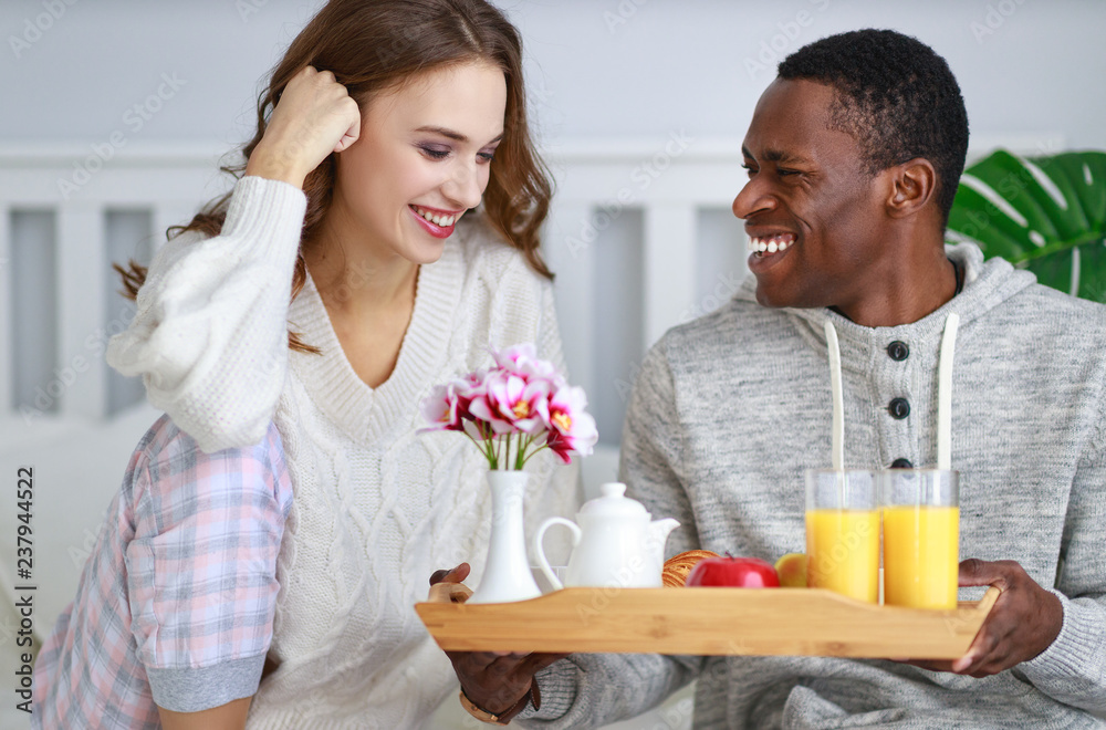 happy couple with breakfast in bed on valentines day