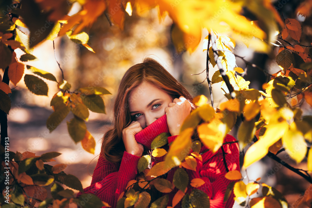 Natural beautiful woman surrounded by leaves, people in nature concept