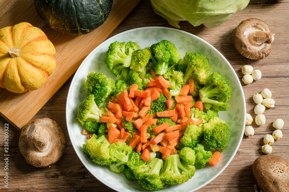 Green broccoli with wooden background