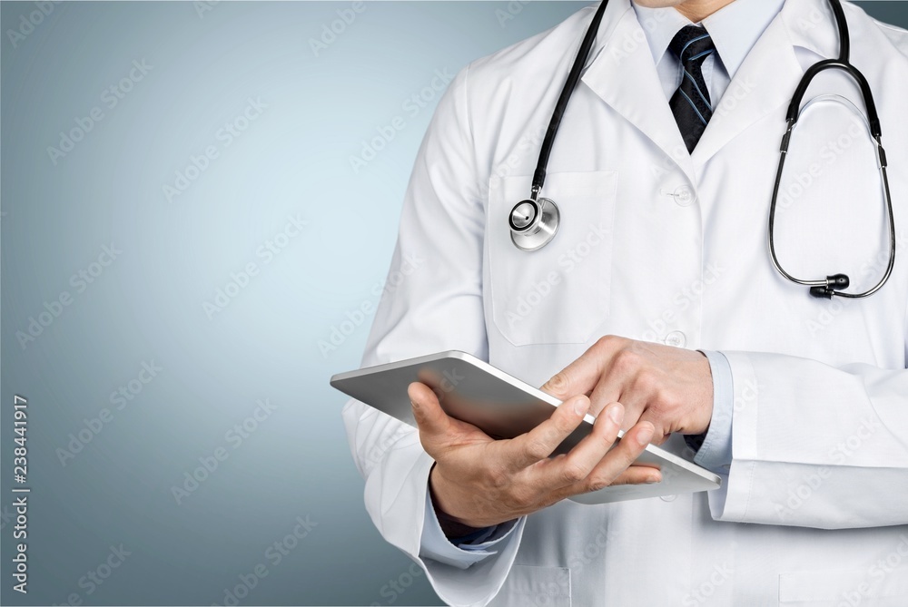 Close-up Doctor at hospital working with tablet pc