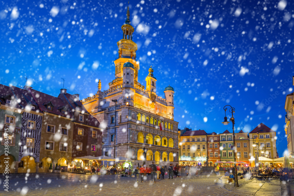 Old town of Poznan on a cold winter night with falling snow, Poland