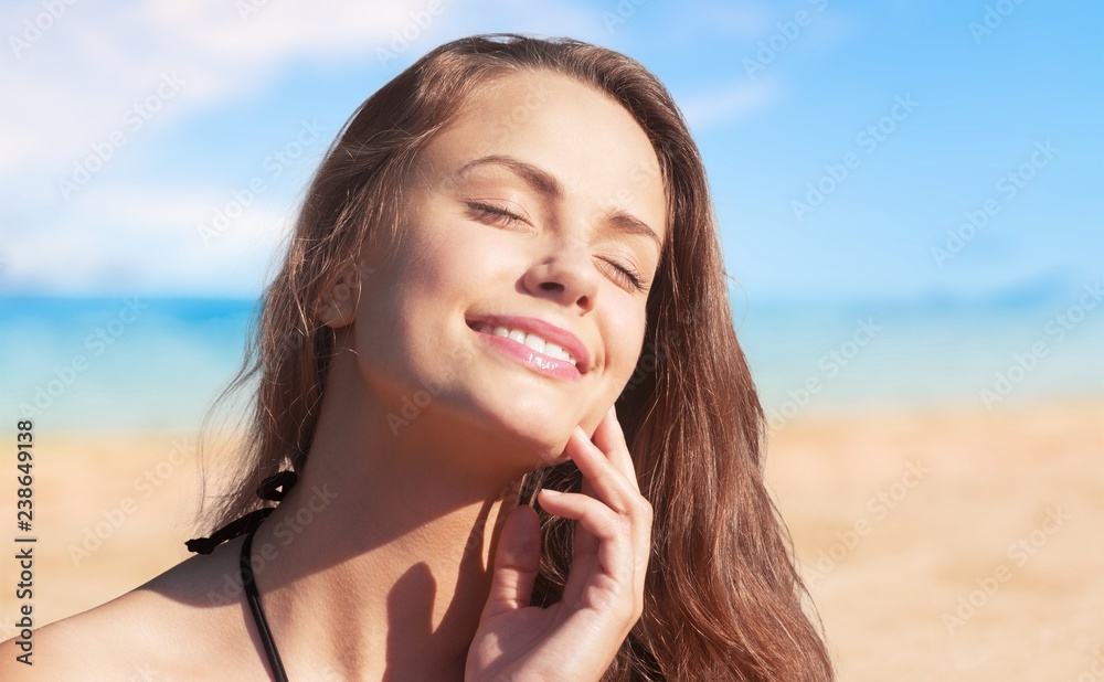 Outdoor summer portrait of pretty young smiling happy woman