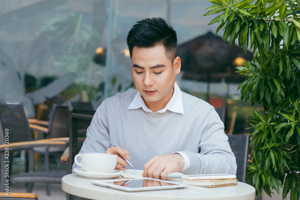 Businessman working at the coffee shop - Image