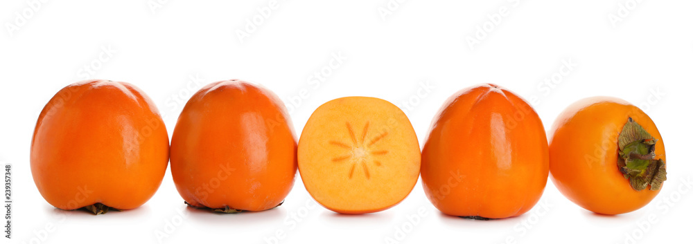 Ripe persimmons on white background