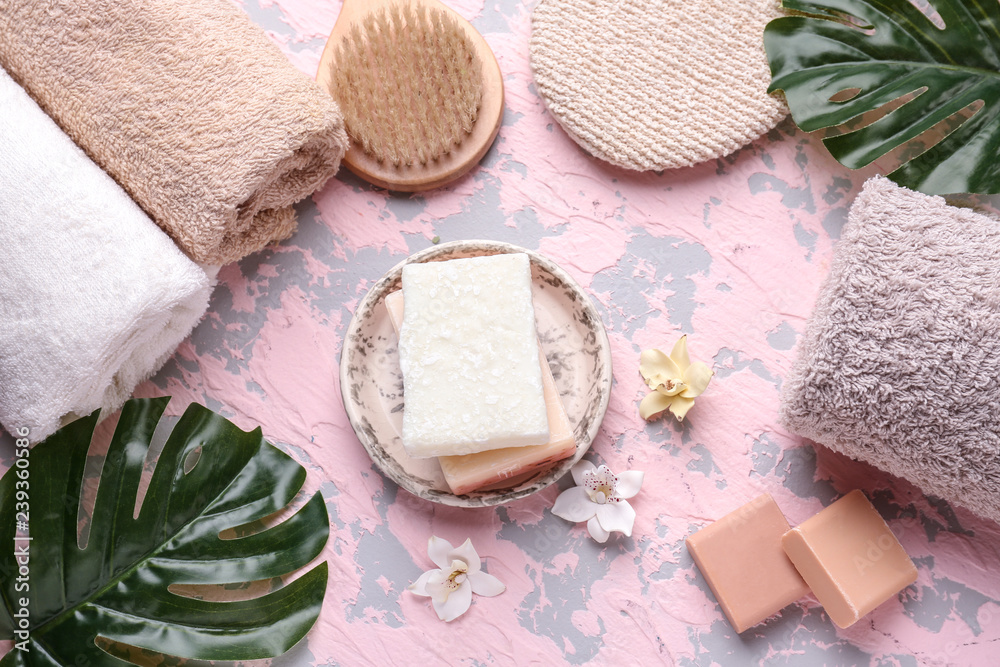 Soap, towels and brush on color table