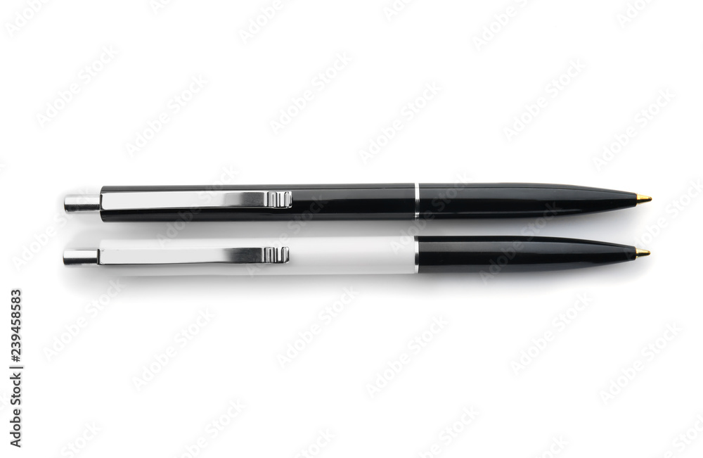 Stylish pens on white background