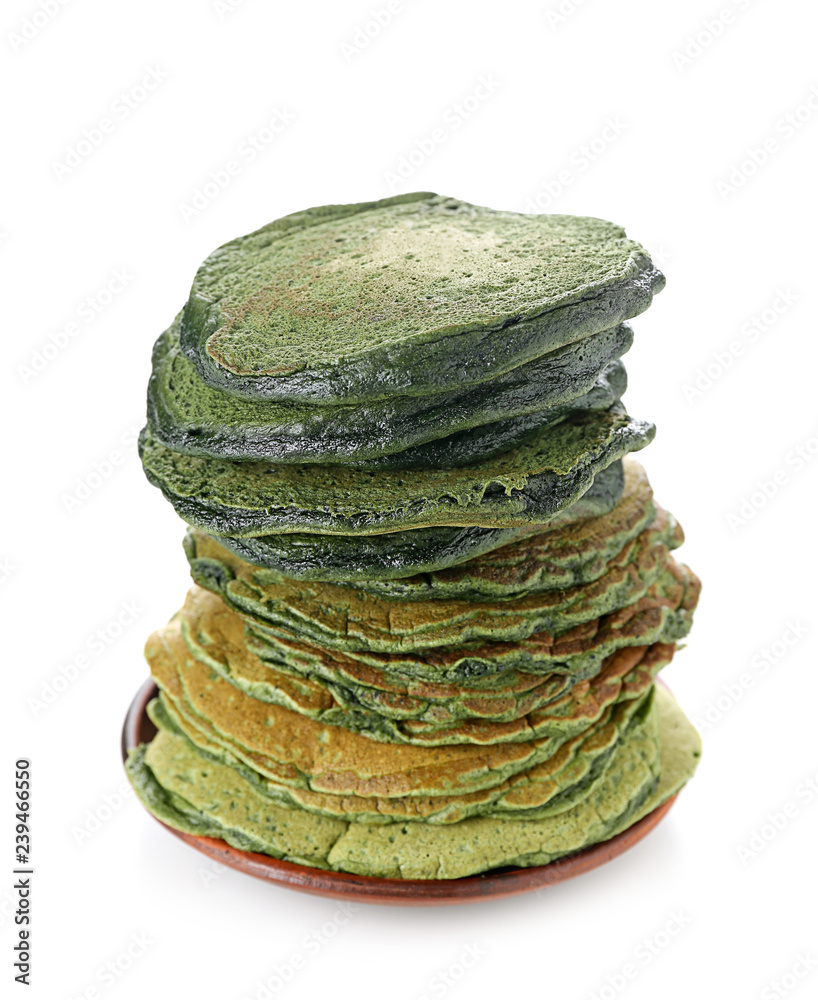 Tasty green pancakes on white background