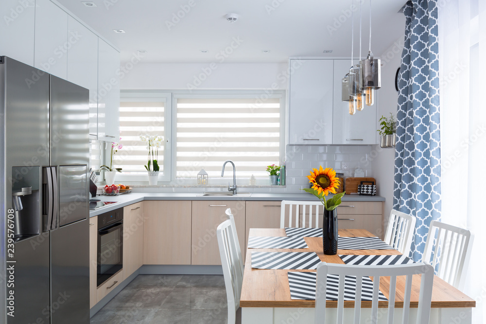 Modern kitchen interior with dining table