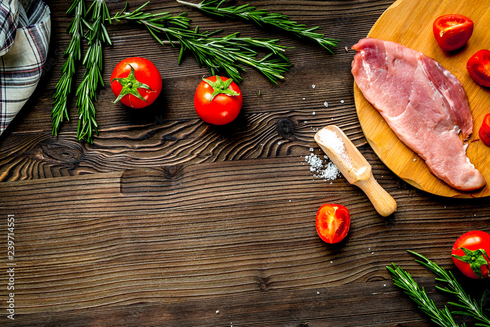 meat for steak with rosemary and tomato on table top view mockup