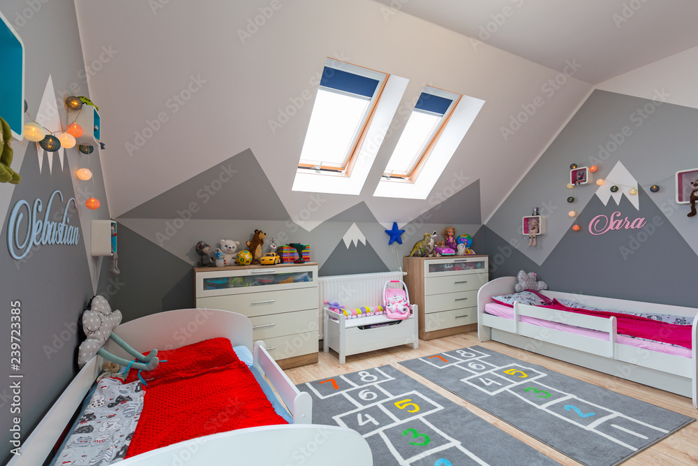 Modern bedroom for boy and girl with furnitures and toys