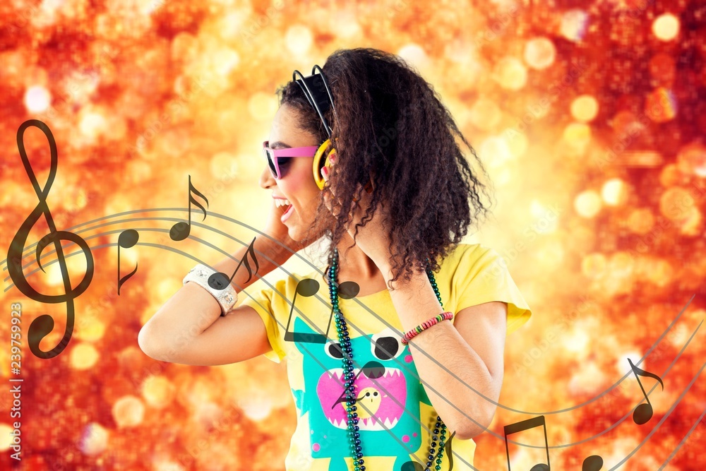 Beautiful disco african girl with headphones on background