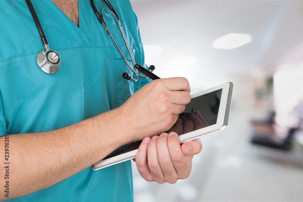 Close-up Doctor at hospital working with tablet pc