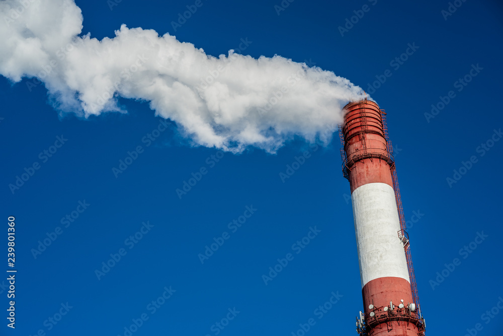 Air pollution, closeup of one big smoking pipe