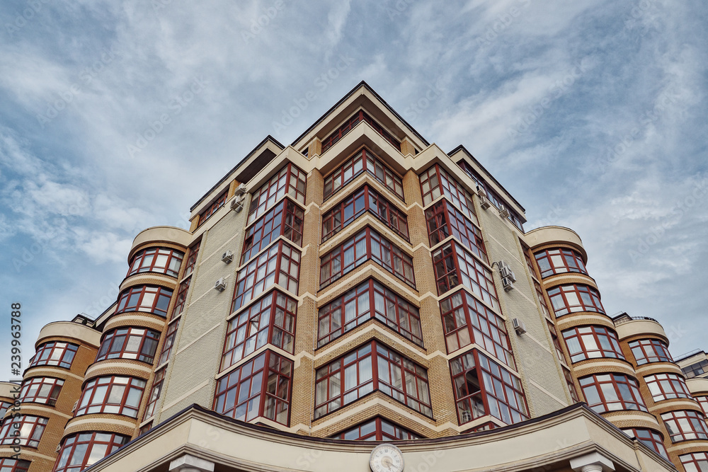 Modern apartment buildings on a sunny day with a blue sky.