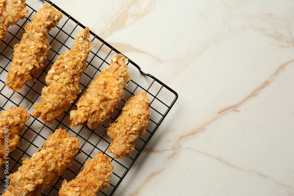 Cooling rack with tasty nuggets on light table