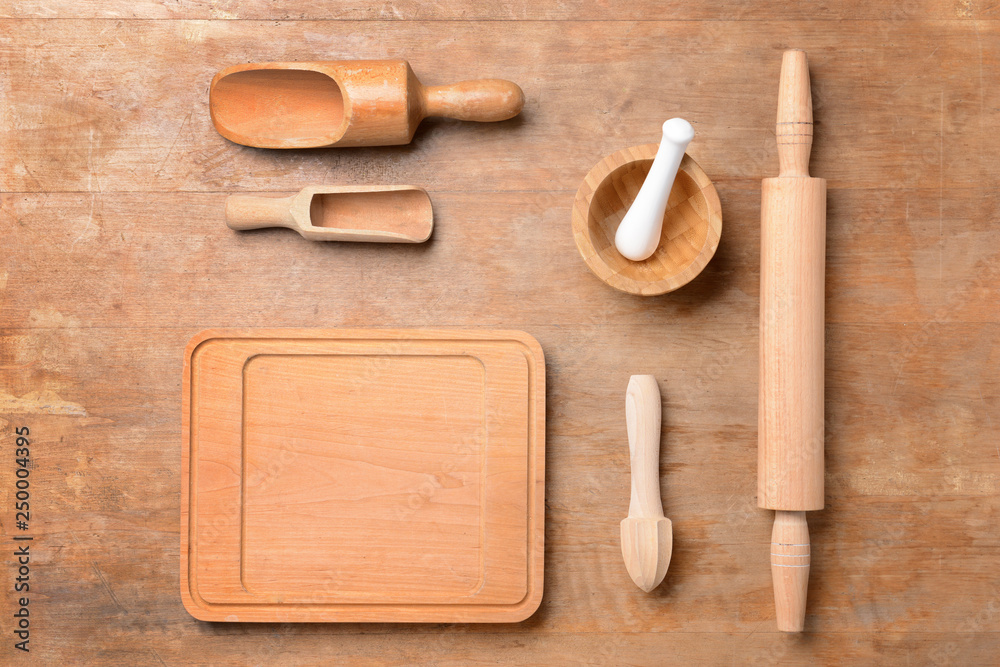 Set of wooden kitchen utensils on table