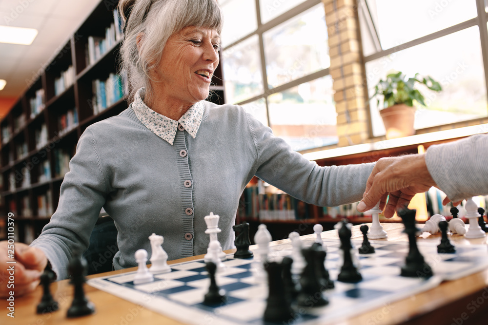 Close up of a woman playing chess