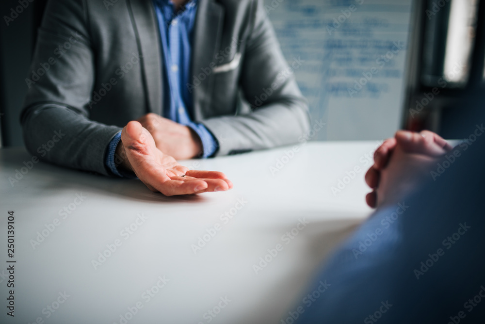 Discussing on a meeting, close-up.