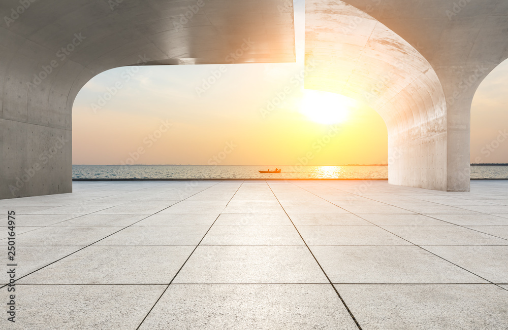 Empty floor and lake with sunset background