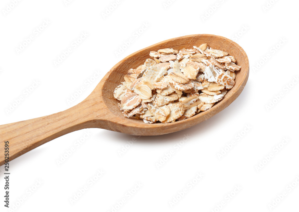 Spoon with oat flakes on white background