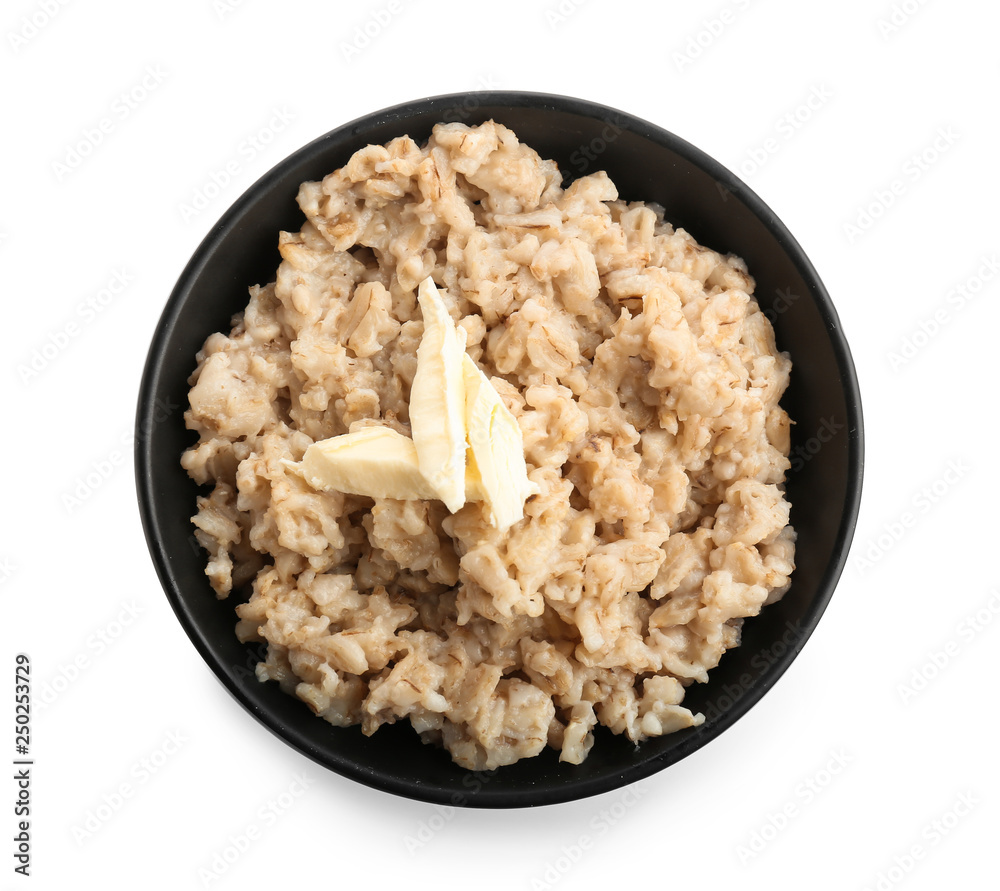 Bowl with tasty oatmeal on white background