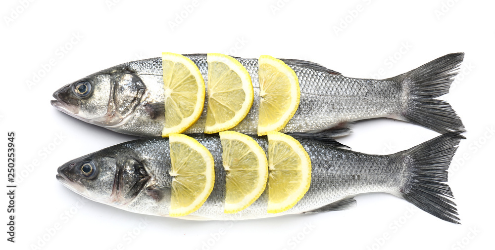 Tasty fresh seabass fish with lemon on white background