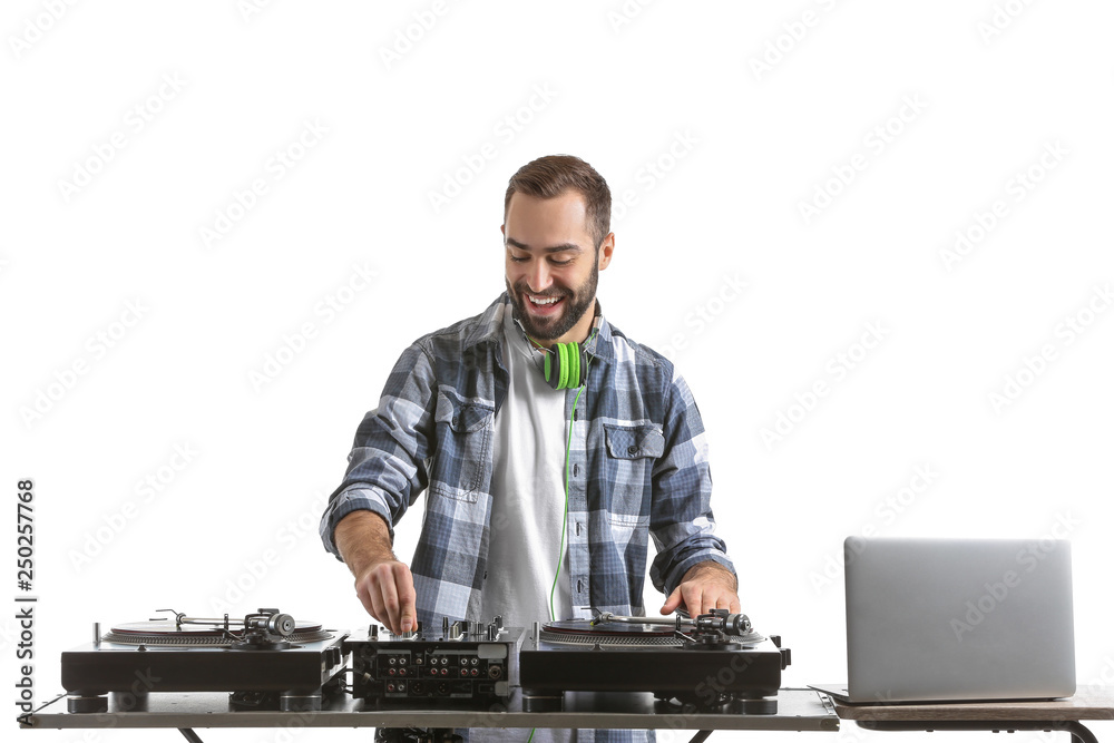 Male DJ playing music on white background