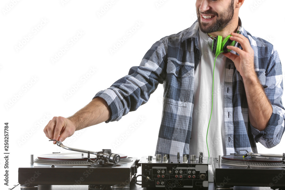 Male DJ playing music on white background