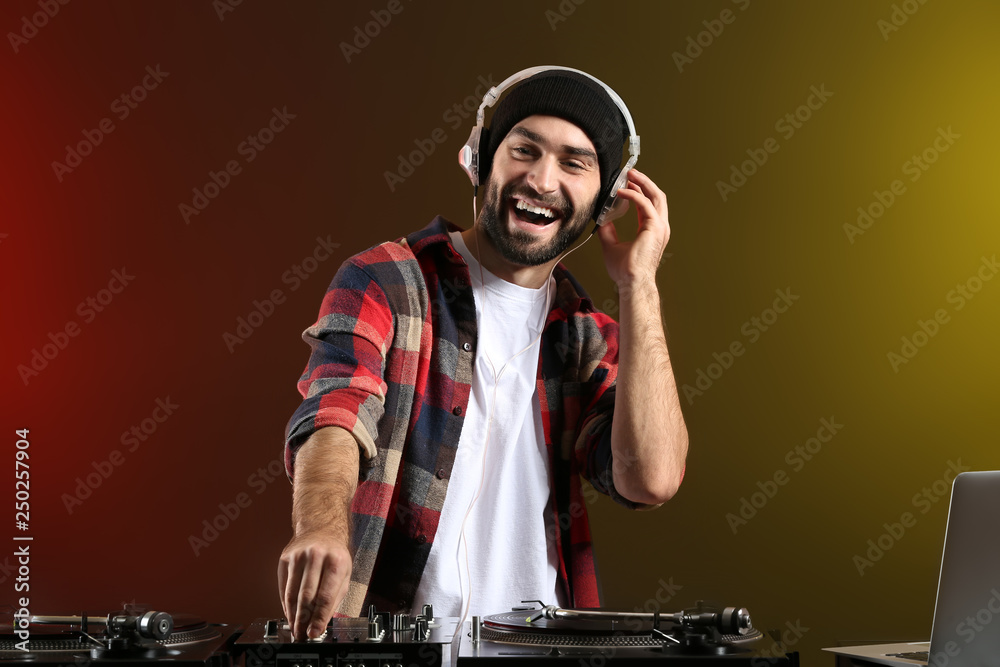 Male DJ playing music in club