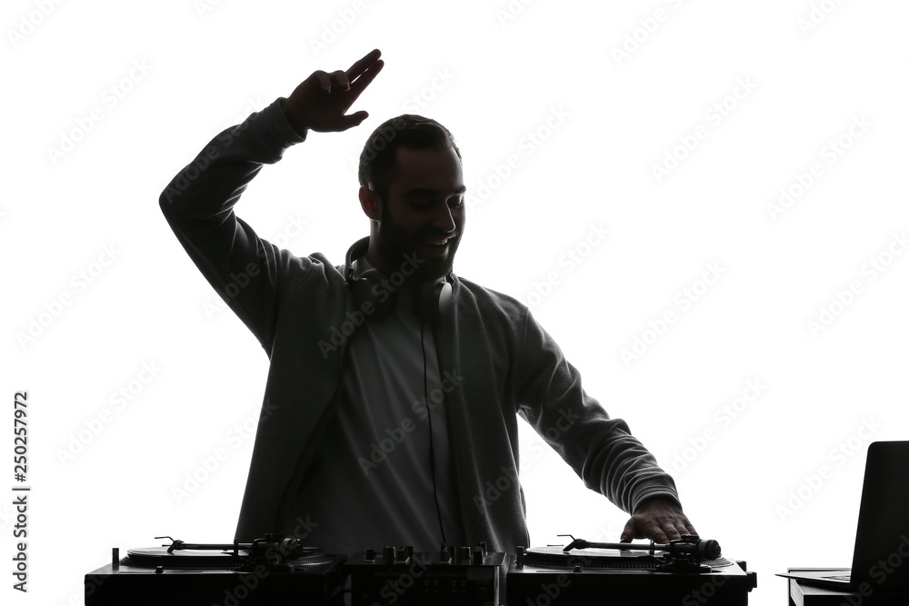 Silhouette of male DJ playing music on white background