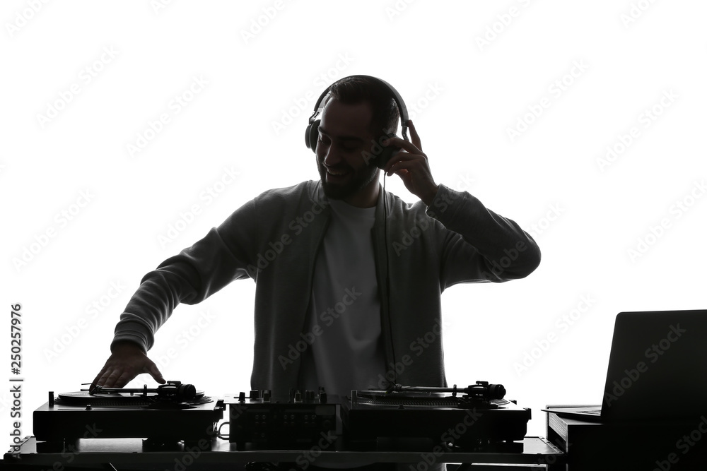 Silhouette of male DJ playing music on white background