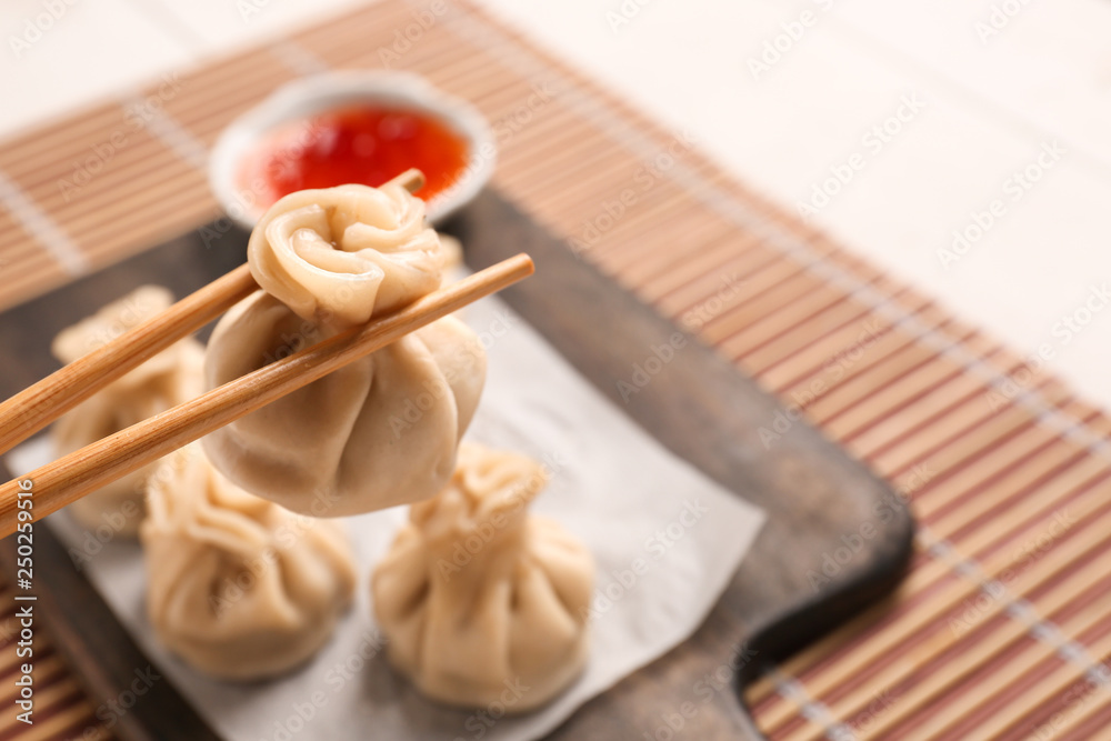 Eating of tasty dumplings, closeup