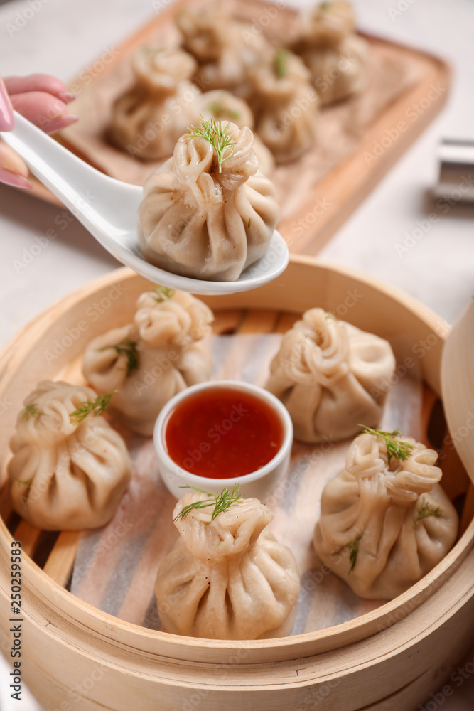 Eating of tasty dumplings, closeup