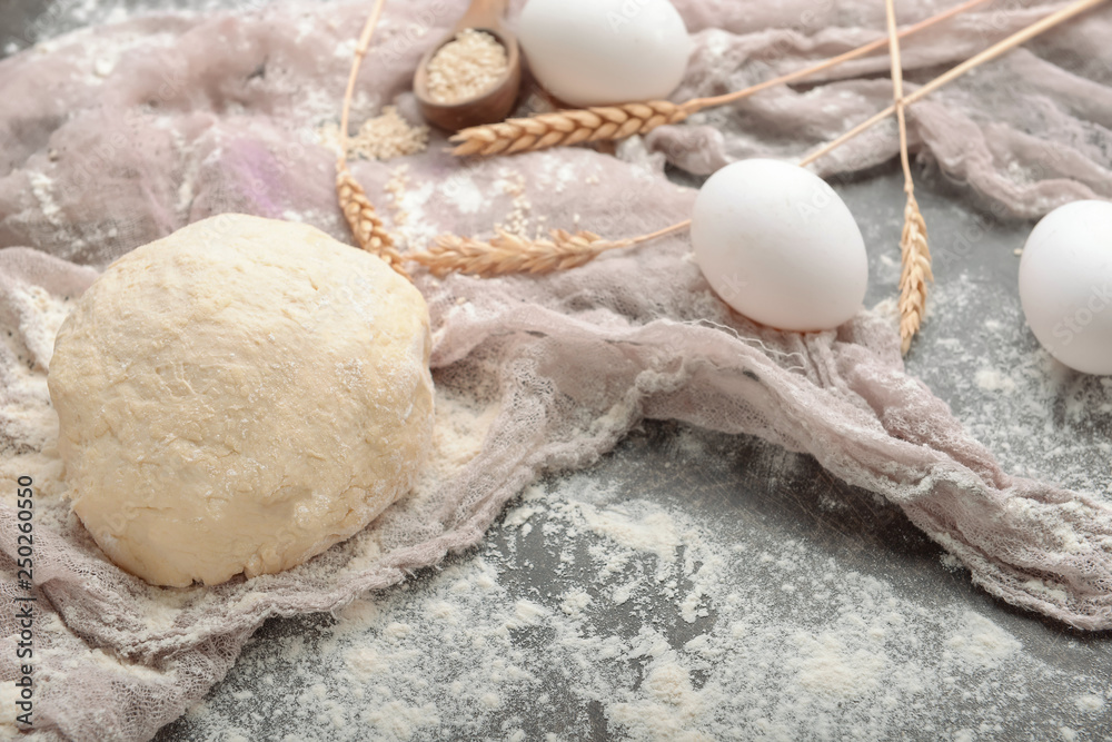 Raw dough for making bread on table