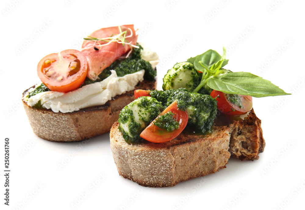 Fresh tasty bruschettas on white background