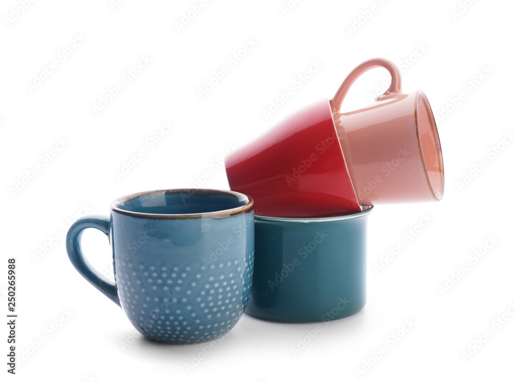 Colorful empty cups on white background