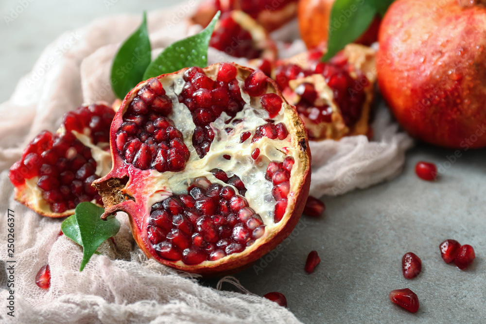 Tasty ripe pomegranates on table