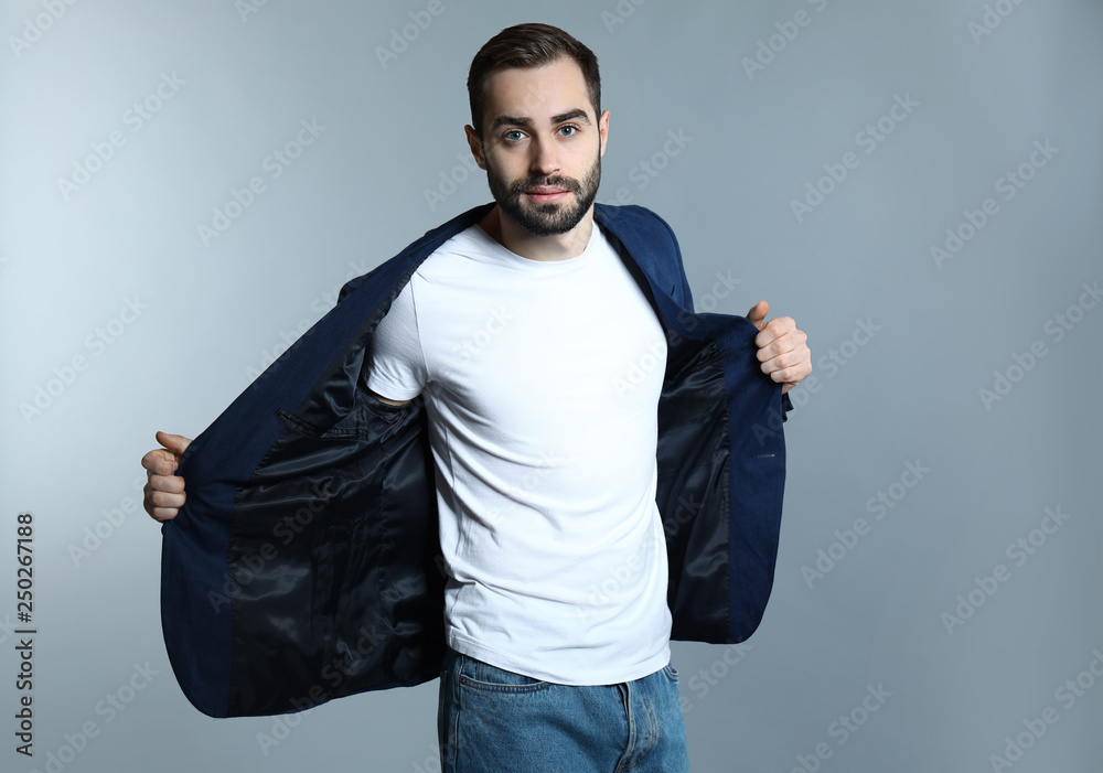 Handsome fashionable man on grey background