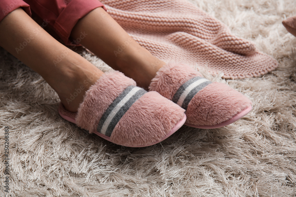 Young woman in slippers at home