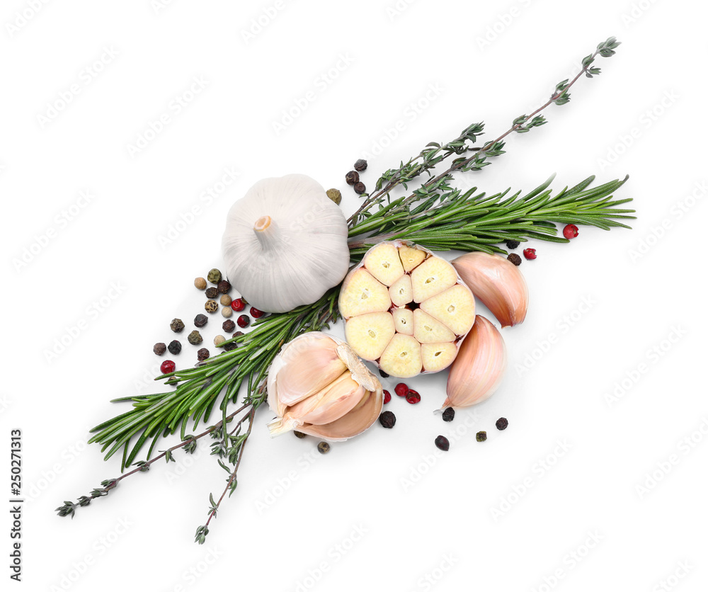 Fresh garlic, herbs and spices on white background