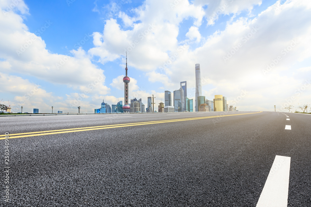 Asphalt road passes through Shanghai Lujiazui Financial District