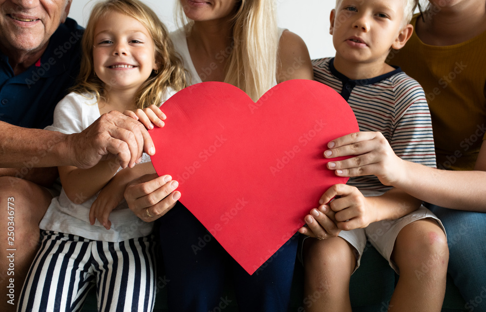 Family showing a red heart symbol