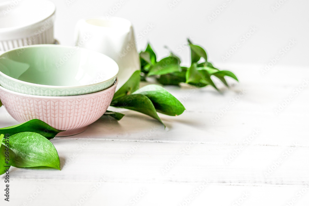 ceramic tableware with flowers on white background