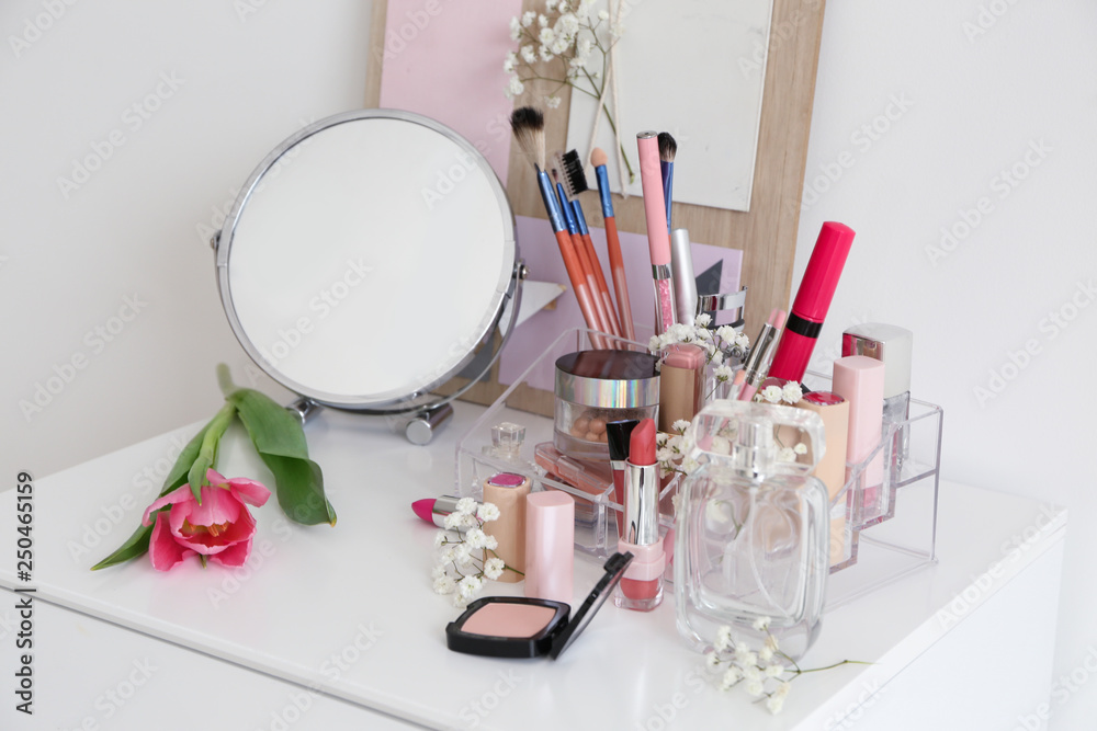 Set of cosmetics on dressing table