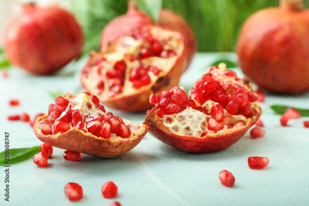 Ripe juicy pomegranates on table