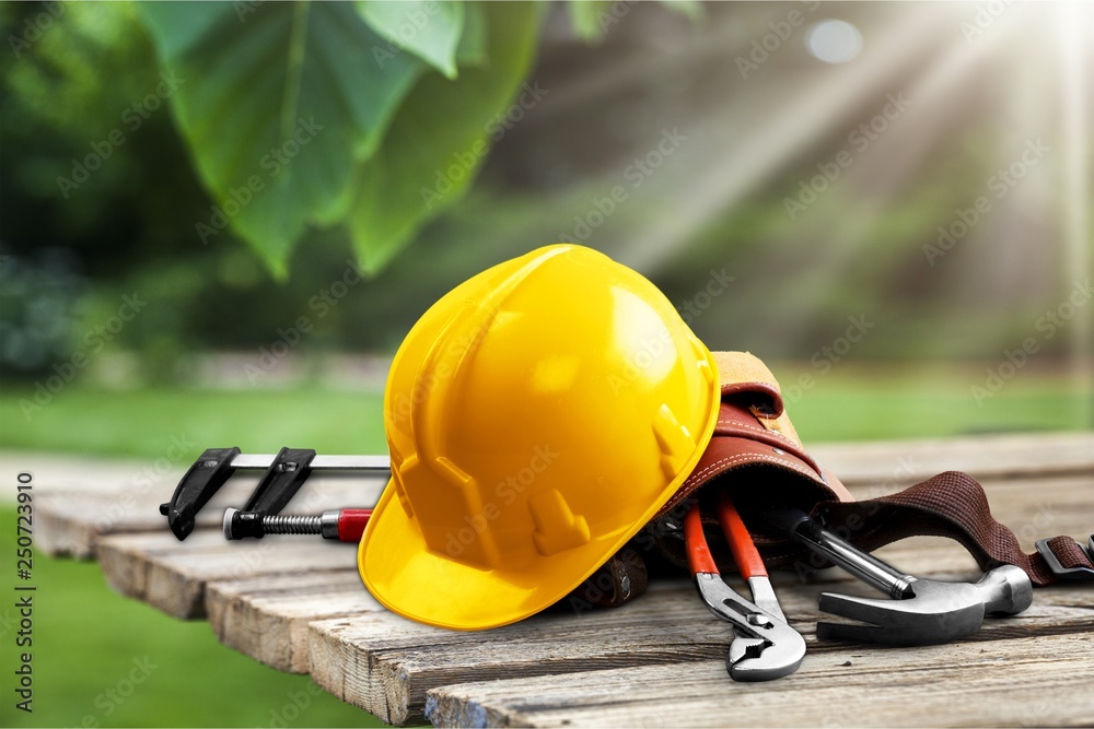 Builder staff laying on wooden desk