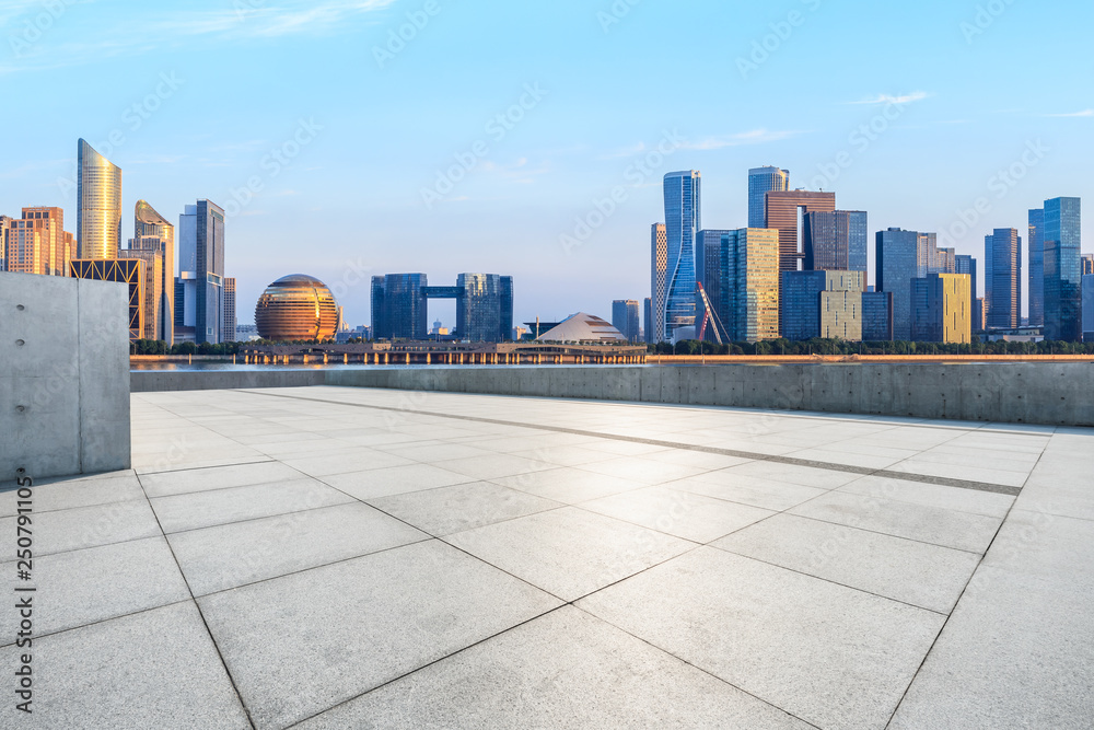 Empty square floor and Hangzhou city skyline with buildings