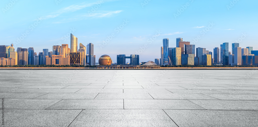 Empty square floor and Hangzhou city skyline with buildings